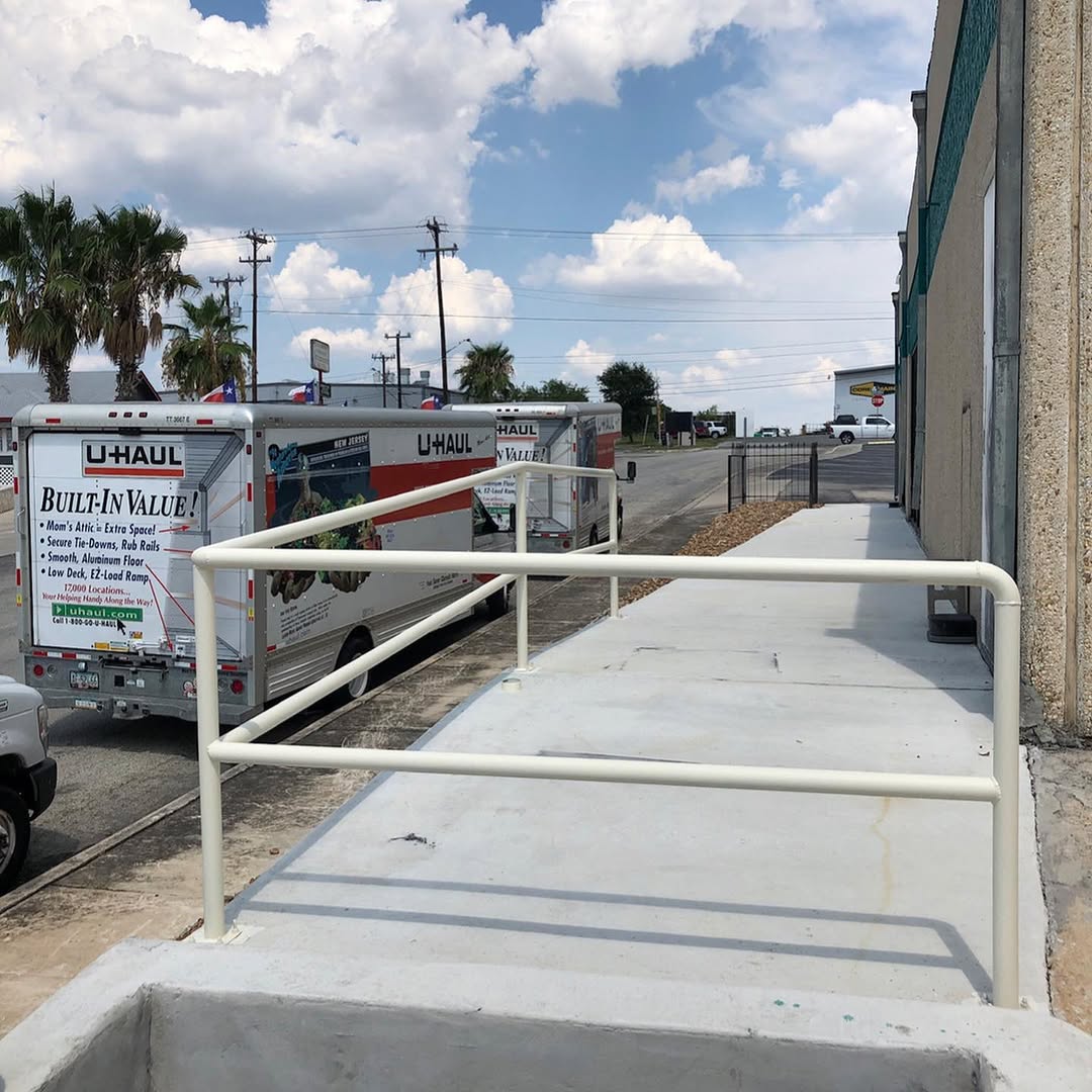 Completed concrete landing with safety handrail
