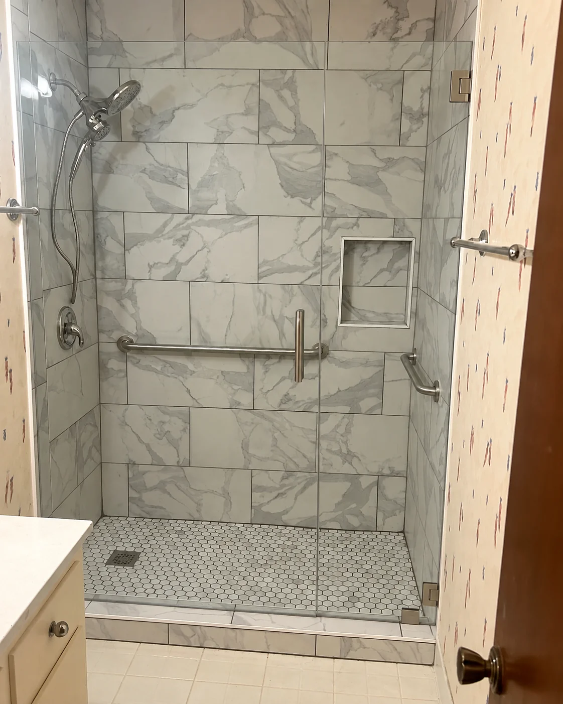 Finished tile shower with frameless glass